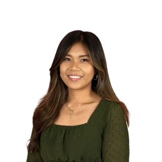 Woman standing against a white background